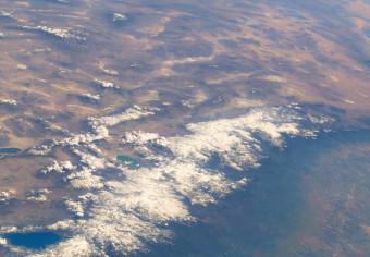 Cuadro decorativo Vista satelital del continente y océano - foto de Tierra desde espacio