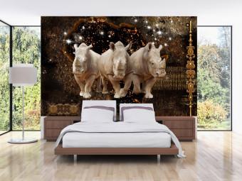 Fotomural decorativo Tres rinocerontes - animales sobre fondo nocturno con el toque dorado