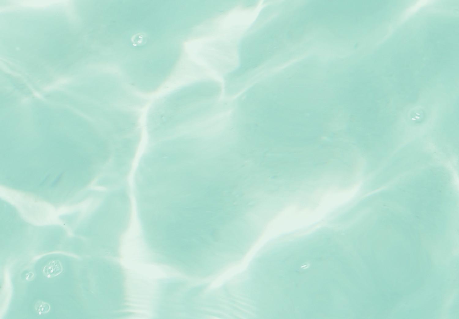 Cuadro Rodajas de pomelo flotando en agua turquesa - abstracción de verano