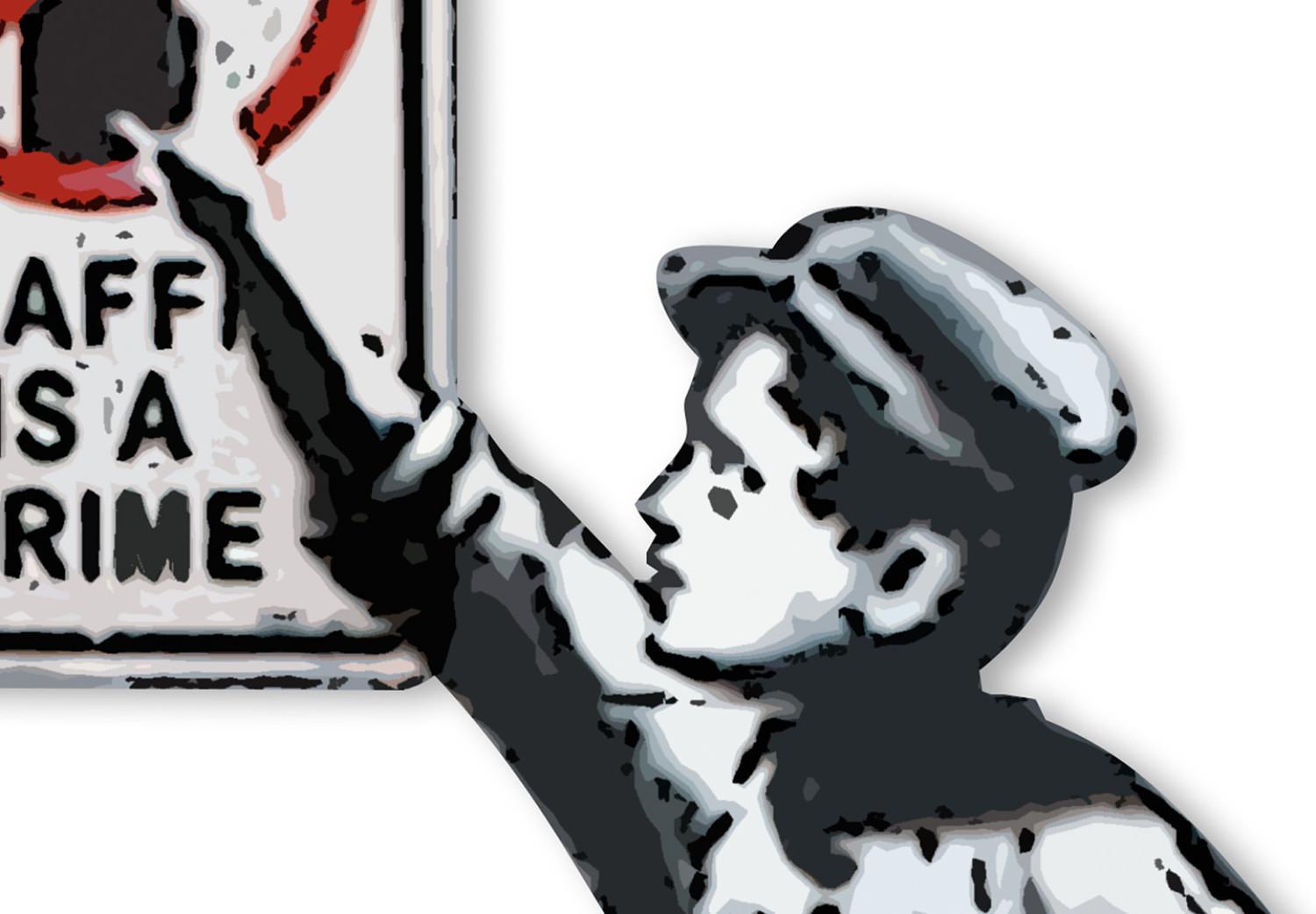 Cartel Graffiti is a crime - persona negra con cartel sobre fondo blanco