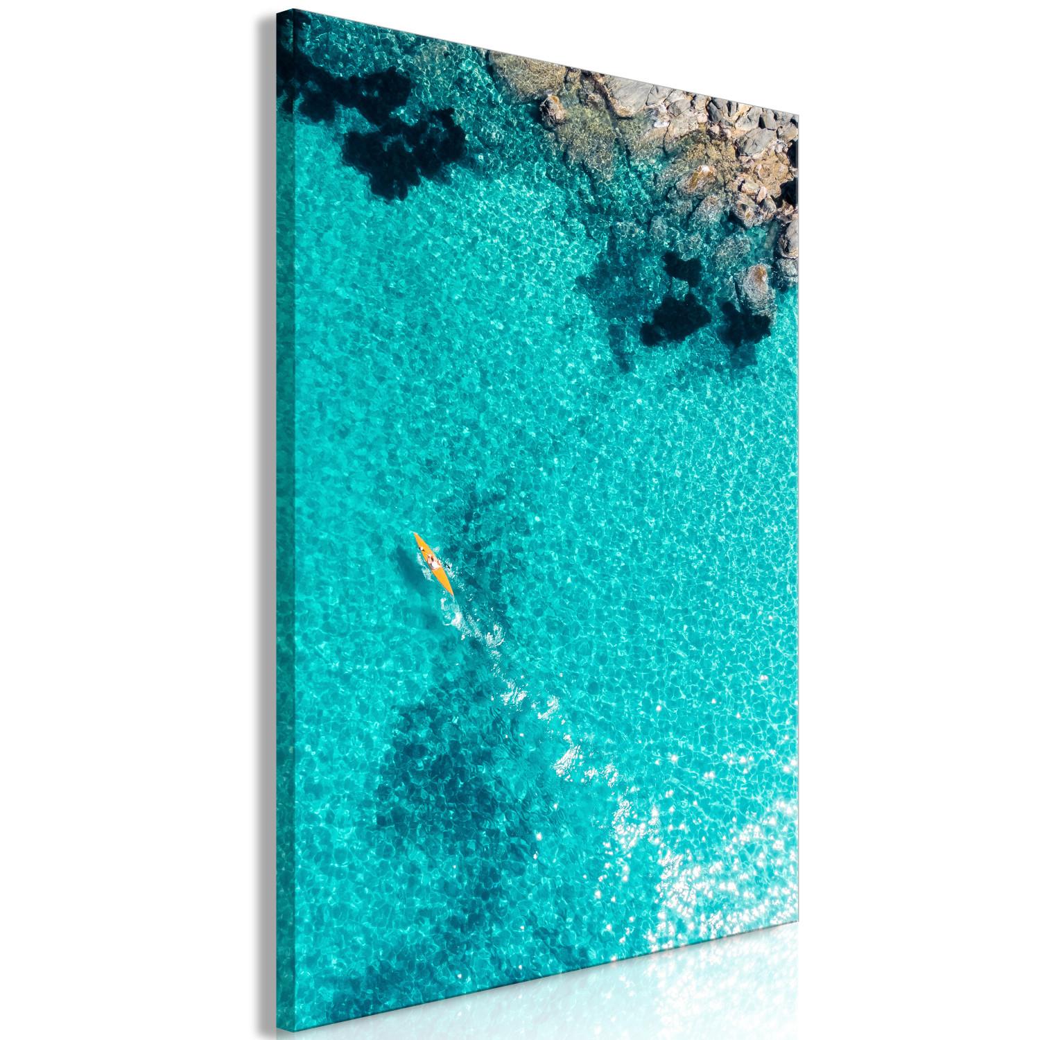 Cuadro decorativo Agua azul - paisaje marino con agua transparente y canoa amarilla