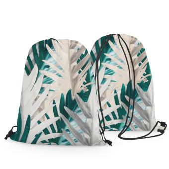 Mochila Philodendron xanadu - a white and turquoise pattern with exotic leaves