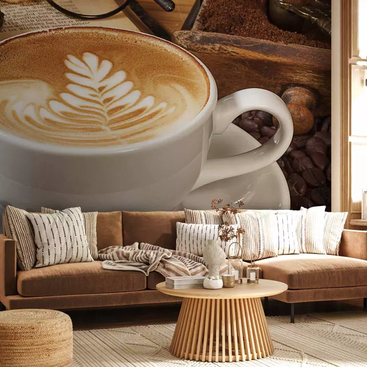 Fotomural decorativo ¿Un café? - taza clásica de café blanco con libro en fondo marrón