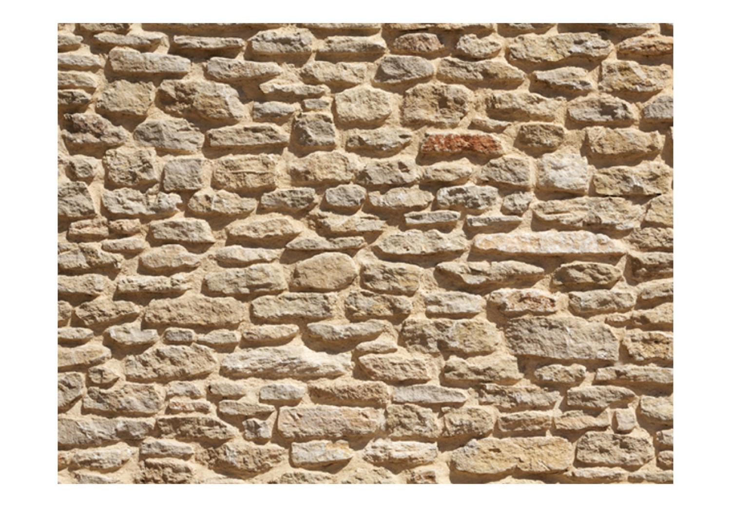 Fotomural a medida Antigua pared de piedra - patrón en muro de piedra de color arenoso
