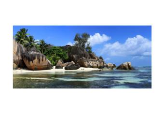 Fotomural Seychelles - Paisaje con una isla rocosa rodeada de playa y aguas