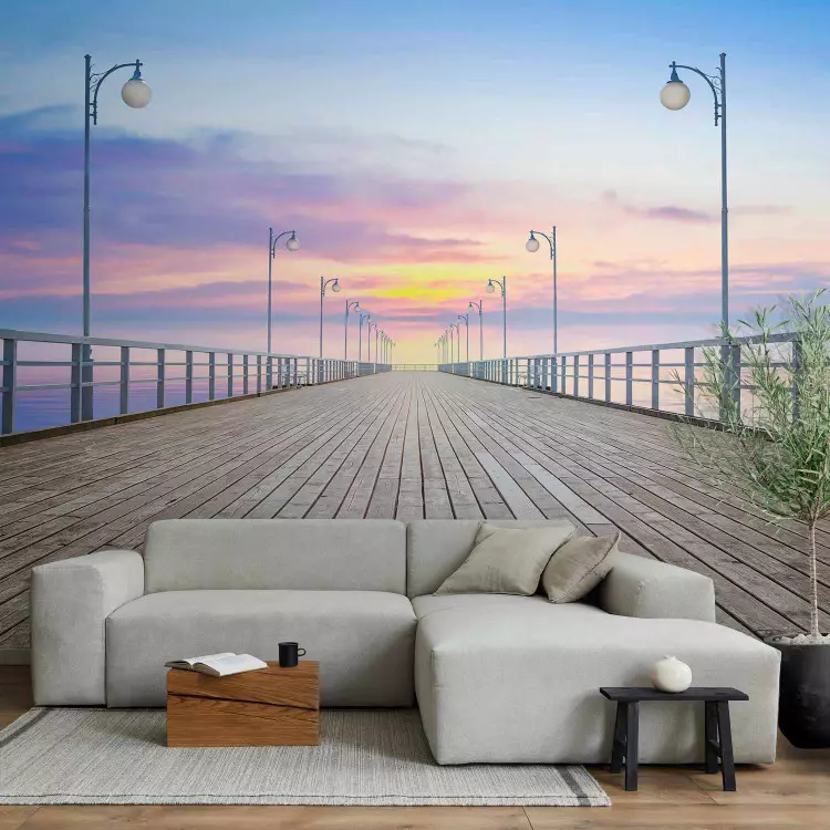 Fotomural decorativo Atardecer en el muelle - Mar tranquilo y un puente blanco