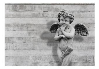 Fotomural Adorable querubín de piedra - Escultura de angelito en cemento