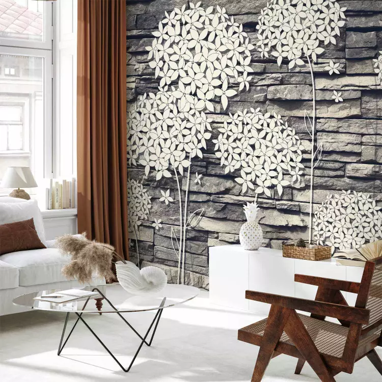 Fotomural decorativo Composición de piedra - flores blancas sobre muro de piedra gris
