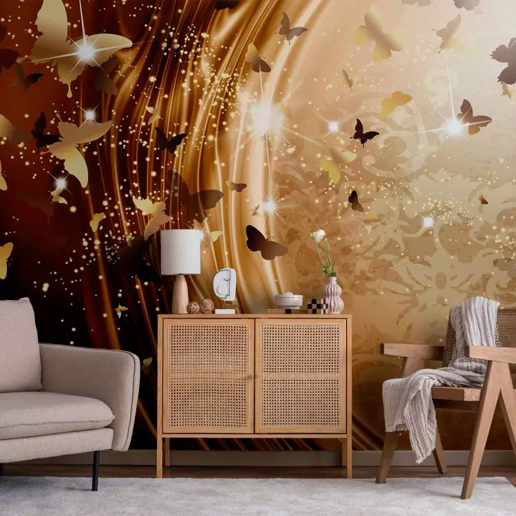 Fotomural decorativo Abstracción - mariposas brillantes en un fondo dorado con ornamentos
