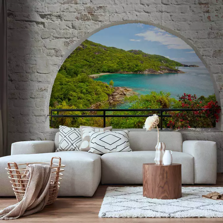 Fotomural decorativo Vista desde la ventana - mar turquesa e isla rodeada de ladrillos