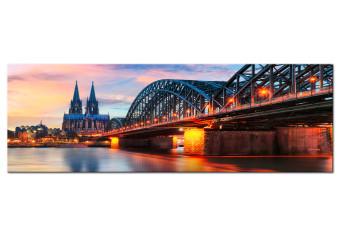 Cuadro Colonia, Alemania - puente iluminado al atardecer sobre la ciudad